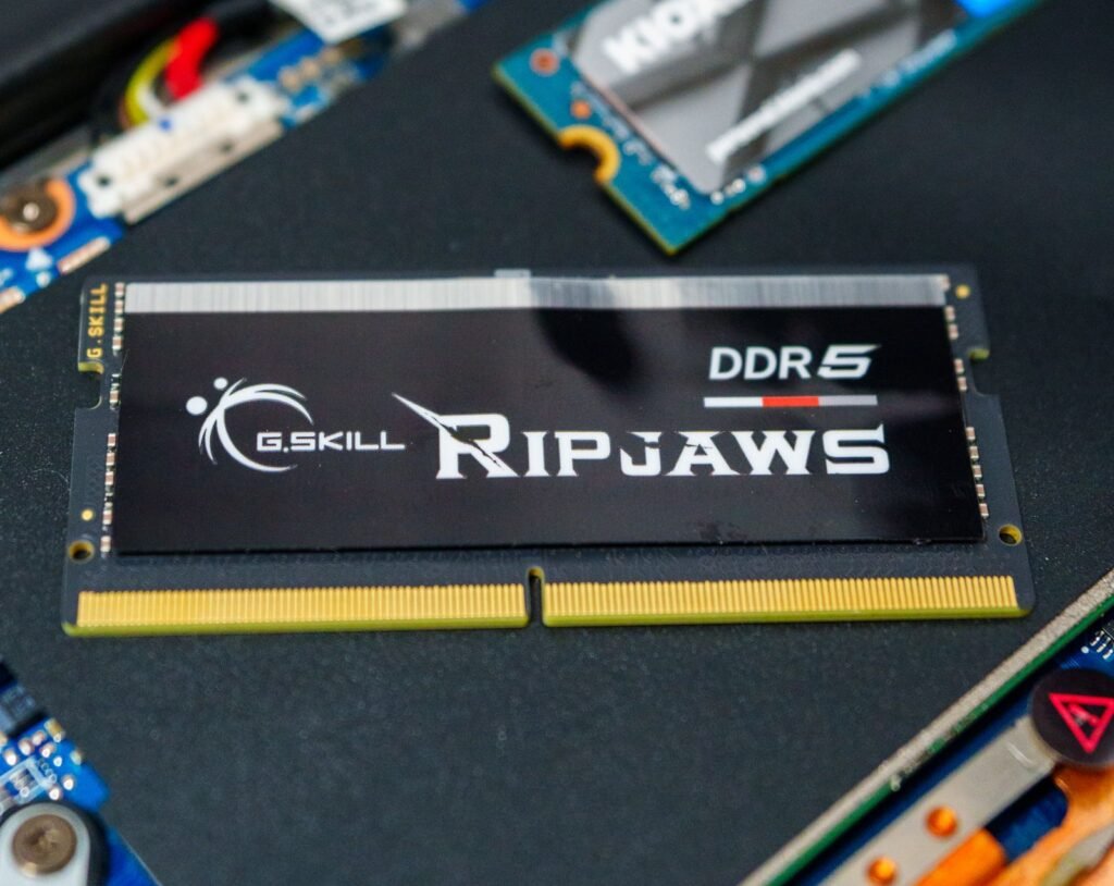 DDR5 RAM sticks lying on a computer motherboard