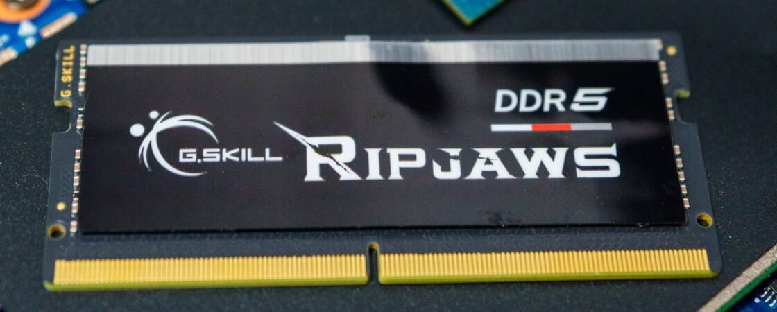 DDR5 RAM sticks lying on a computer motherboard