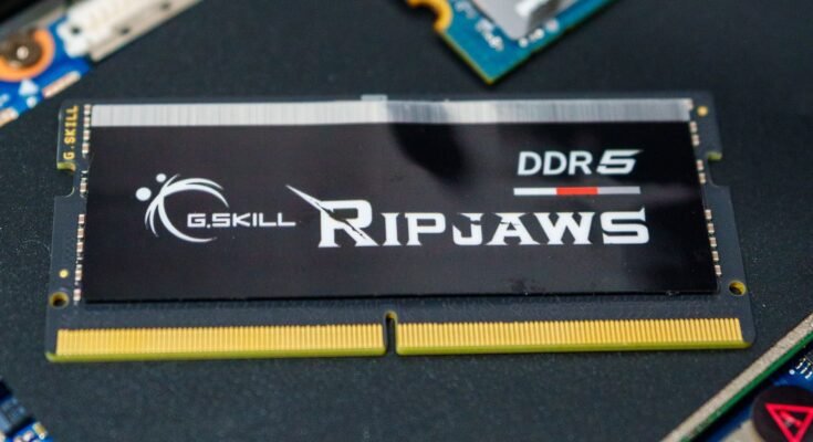 DDR5 RAM sticks lying on a computer motherboard