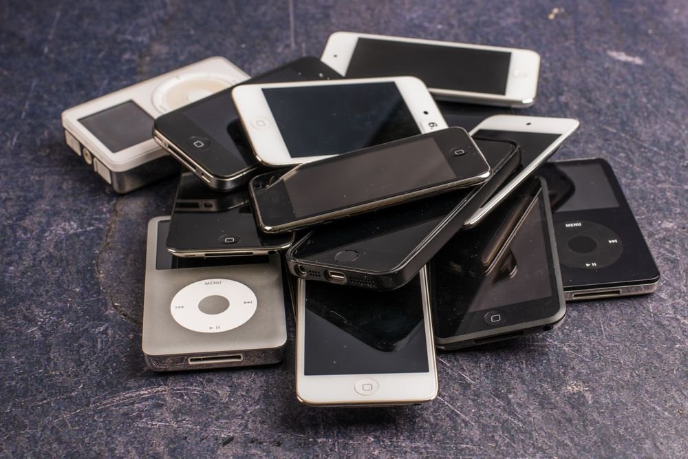 Pile of old smartphones showing classic phones from generations past
