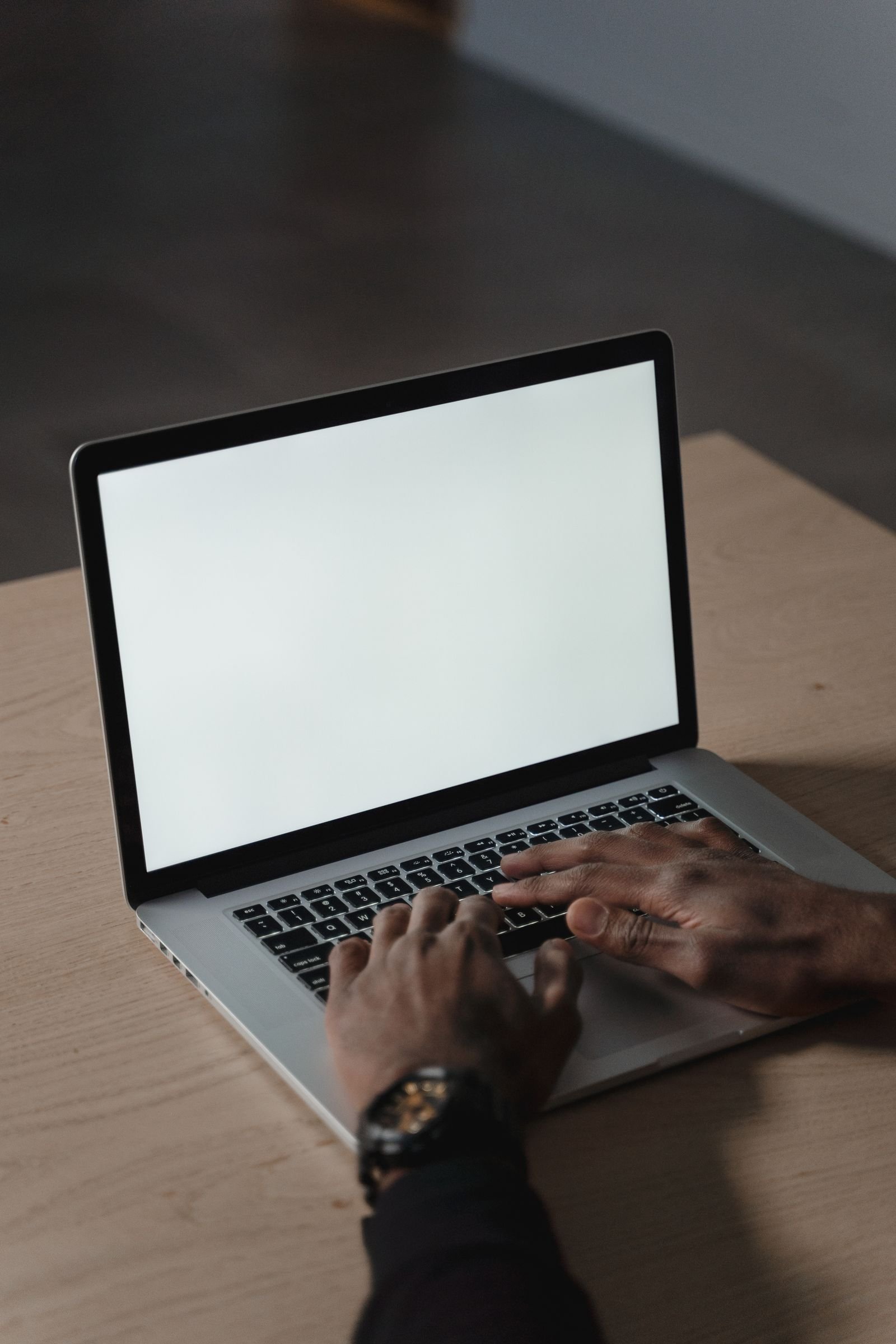 Typing on a laptop keyboard during a laptop speed boost cleanup