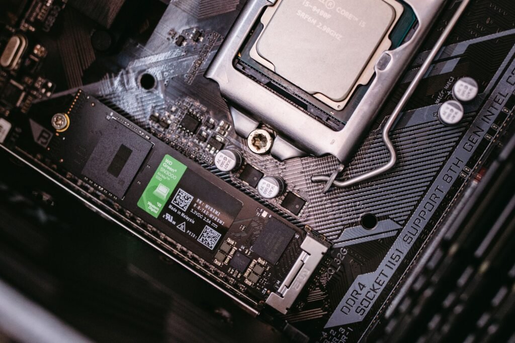Motherboard with CPU and installed SSD showing both key components inside a PC