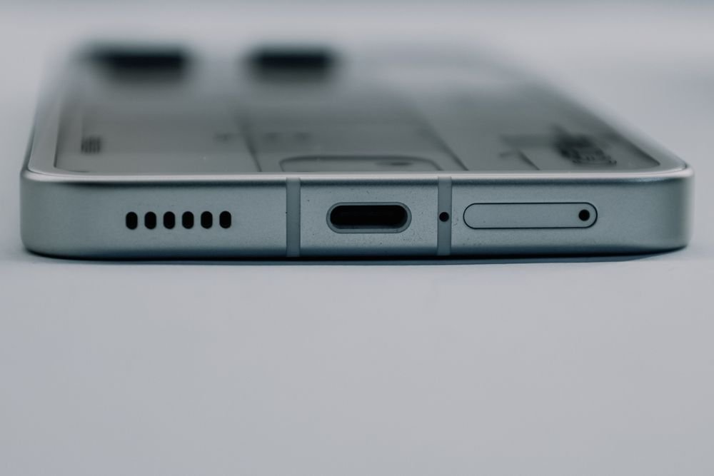 close up of smartphone usb c port and speaker grille